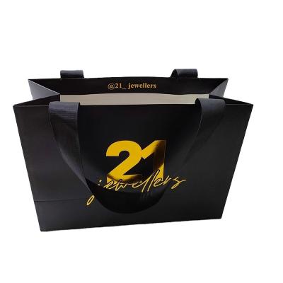 China Recycled Materials Custom Print Black Luxury Paper Gifts Bags With Your Own Logo for sale