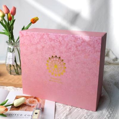 China Recyclable Luxury Flat Packing Folding Cardboard Box Ribbon Closures Pink Paper Book Shaped Foldable Packaging Gift Boxes With Magnetic Lid for sale