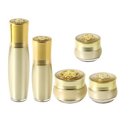 China Luxury Type Cosmetic Lotion Bottle Factory Direct Selling Flower Pattern Top Cover Rotary Switch Acrylic Cream Jar Set for sale