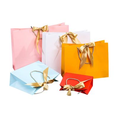 China Disposable Custom Luxury Paper Gift Shopping Bag With Ribbon Closure for sale