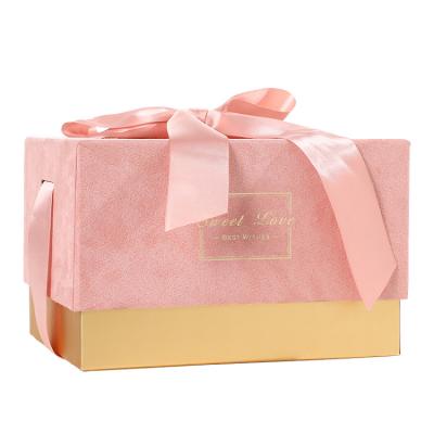 China Custom Pink Matte Folding Rigid Paper Packaging Disposable Box Gift Box With Ribbon Closure for sale