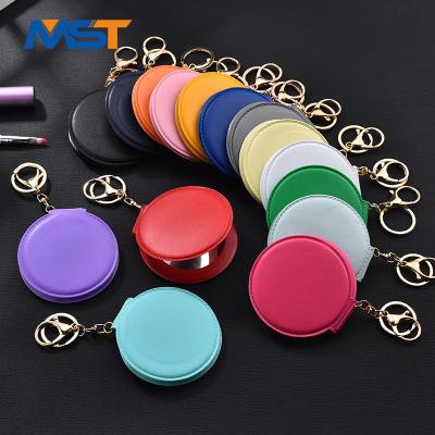 China Mobile Phone Case Pendants 2020 Small Cosmetic Mirror PU Mirror Key Chain Folding Round Double Sided Mirror Pendant for sale