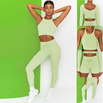 China Breathable Women New Seamless Ribbed Candy Colors Yoga Set Knots Lace Up Sports Bra Crop Top Gym Fitness Set for sale