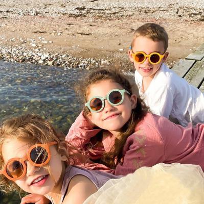 China 10 years of experience NIWOTA baby children cute 1319 glass round 2021 fashionable portable sunglasses for sale