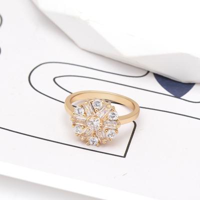 China Simple Classic Wholesale Brass Jewelry Designs Flower Shape Gold Ring Rhinestone Wedding Rings For Ladies for sale