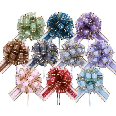 China Double Gold Pom Pom Pull Bow Ribbon With Flower Organza Pull Bow Price Wedding Decoration Gift Wrapping Best Line for sale