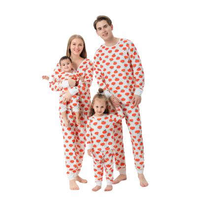 China New European and American Winter Pumpkin Printing Breathable Orange Sleepwear For Men Women Children Kids Family Christmas Long Sleeve Pajamas for sale