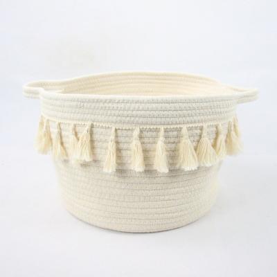 China Viable hot sale small white woven cotton rope storage basket with tassel and handle for office or home for sale