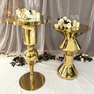 China Contemporary latest style round glass top gold bar stand metal base cocktail table for sale