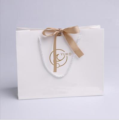 China Recyclable Factory Customize Bow-knot Gift Paper Bag With Your Own Logo for sale