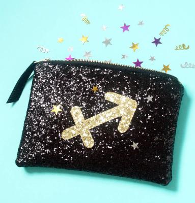 China Black Canvas Glitter Printed Zodiac Sign Glitter Clutch Cosmetic Bag Wholesale Makeup Organizer Bag for sale