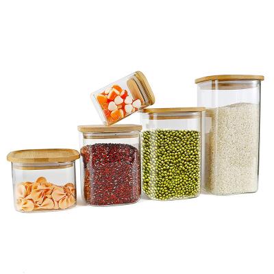 China Sustainable Airtight Canisters Kitchen Use High Borosilicate Airtight Clear Glass Storage Jars with Bamboo Lids for sale