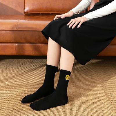 China Breathable Mid-tube Female Smile Face Customized Autumn And Winter Pure Cotton Happy Pile Socks for sale