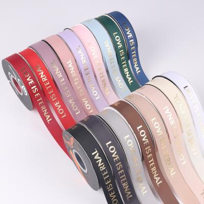 China Waterproof Colorful LOVE Word Florist Wrapping Ribbons Party Decoration Ribbon Hot Stamping Nylon Gift Wrapping for sale