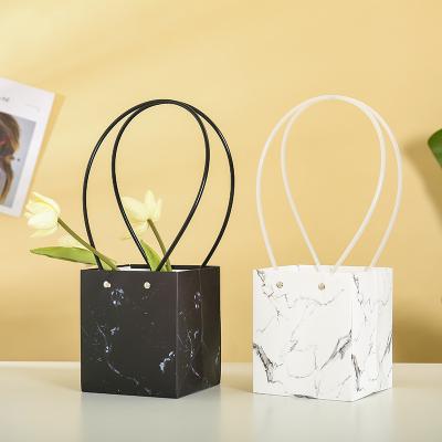 China Good quality decoration MARBLE texture craft bags trapezium and rectangle paper handbag plant flower box recyclable party baskets for sale