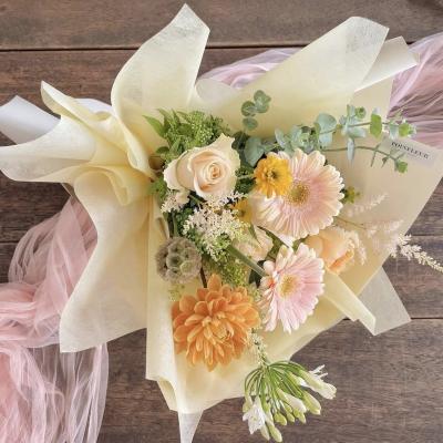 China Waterproof good quality new arrival flower wrapping paper nonwoven weeding and decoration fancy party paper for sale