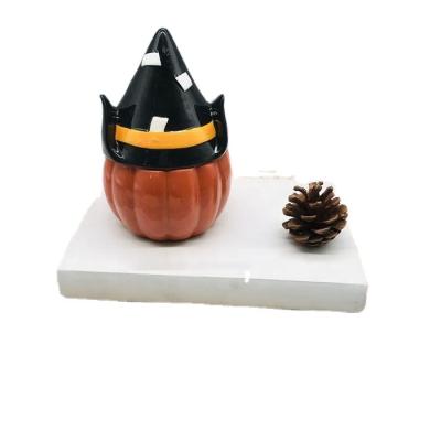 China Christmas Home Decorations Ceramic Pumpkins With Hat For Halloween Decor for sale