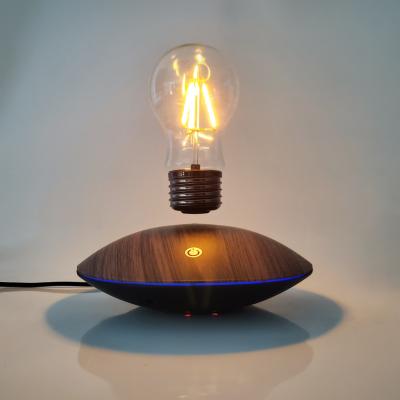 China Creative Modern Levitating Bulb Lights and Gifts Unique Home Decoration Bulb Lamp Floating Wooden Table Lamp for sale