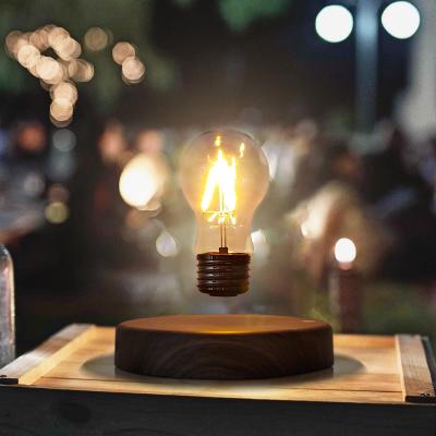 China Modern New Design Light Bulb Lights Wooden Base Magnetic Levitating Floating Light Bulb Table Lamp for sale