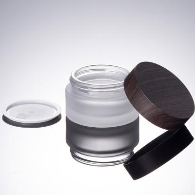 China Recyclable Luxury Clear 30g Frosted Empty Cosmetic Box Glass Cream Jars With Wood Grain Cover for sale