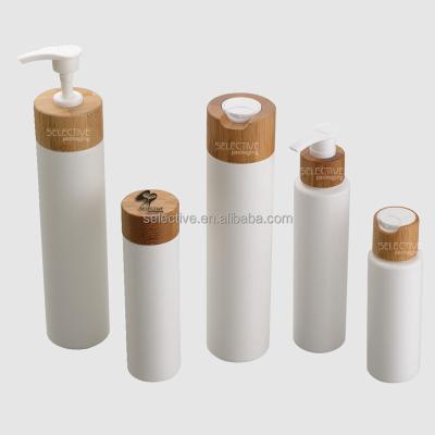 China Personal Care Soft PE Plastic Squeeze Cosmetic Lotion Bottles With Wooden Lids for sale