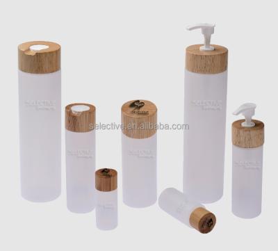 China Household Products Pe Plastic Squeeze Cosmetic Lotion Bottles With Rubber Wood Lids for sale