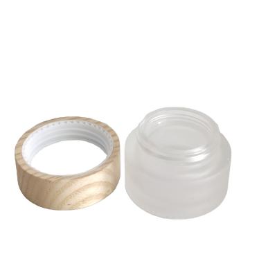 China Personal Care 50g Cosmetic Face Cream Jar With ASH Wood Lid 50g Glass Jar for sale