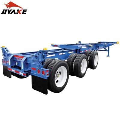 China Jiyake Truck Trailer Hot Sale 2/3/4 Axles Skeleton Semi Trailer 20FT 40FT 45FT Container Carrier Flatbed Trailer Skeleton Truck Trailers for sale