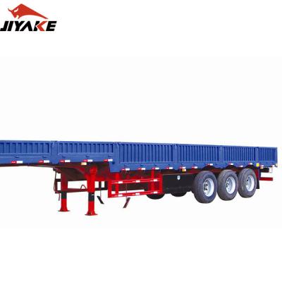 China Truck trailer price 2 best 3 4 axles 40 60 80 ton side wall trailer dropside side wall trailer cargo boards barrier semi truck trailers for sale for sale