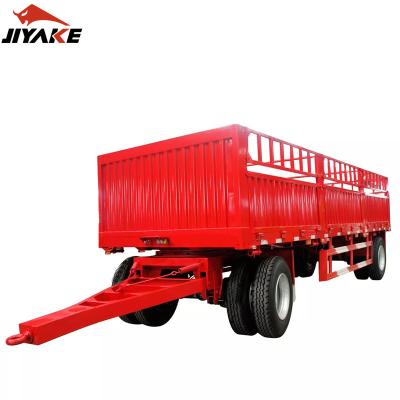 China Truck Trailer 2/3 Axles 40 Ton Barrier Flatbed Truck Trailers Utility Side Wall Trailers Truck Cargo Carrier Semi Open Trailer With Drawbar for sale