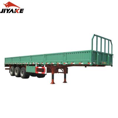 China Truck Trailer Jiyake Hot Selling Customize Triaxle 2 3 4 Axle 60 Ton Dropside Semi Trailer Barrier Side Wall Trailer Tips Truck Trailers for sale