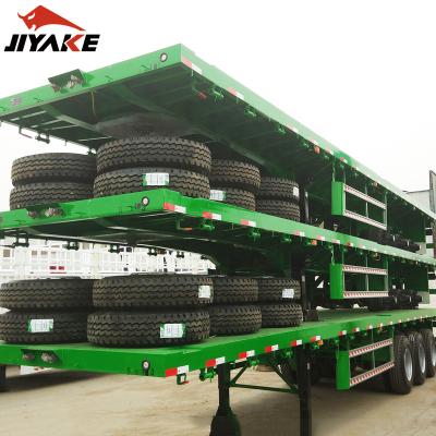 China Truck Trailer Howo Truck 3 Axles 40ft 50tons Flat Bed Container Chassis Tractor Trailer Flatbed Semi Trailer for sale