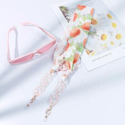 China New Season Anti-drop Hot Sale Retro Design Cool Ladies Glass Silk Scarf Chain With Multiple Printed Patterns Sunglasses Chain for sale