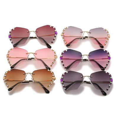 China Diamond Sunglasses Female Luxury Personality Rimless Balanced Polygonal Lenses Point Drill Frame Sunglasses Fashion Sunglasses New for sale