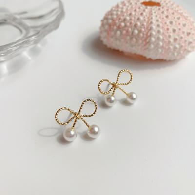 China Fashionable small fashion pearl earrings new bow pearl simple feminine sweet girl earrings for sale