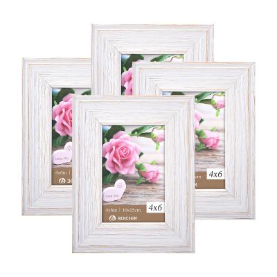 China Hot Selling Eco-friendly Durable Framed Picture White Collage Yiwu Art Picture Frame for Table Top Display and Wall Stand for sale