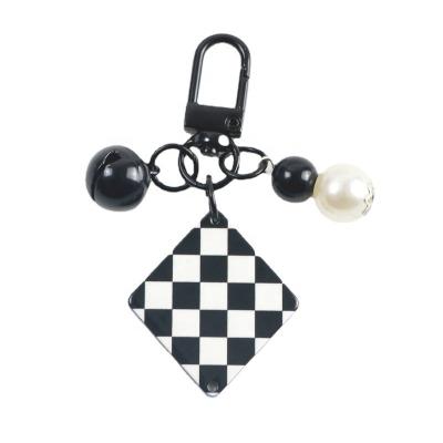 China Other Creative Leather Female Shell Pendant Accessories Earphone Bag Black And White Key Chain Ins Love Lattice Acrylic Square Card for sale