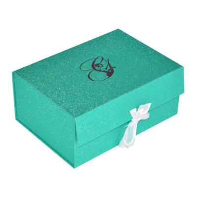 China Recycled Materials Magnet Cardboard Small Folding Gift Box With Silk Ribbon Handle for sale