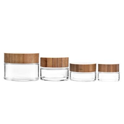 China Hot Selling 30g 50g Cover Around Cover Luxury Empty Bamboo Travel Factory Portable Face Cream Glass Cosmetic Jar for sale