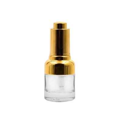 China High Quality 50ml Personal Care Beautiful Clear Clear Essential Oil Round Glass Bottle With Gold Pressure Dropper for sale