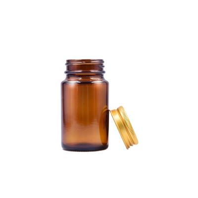 China Factory direct sale 75ml eco-friendly recyclable amber round pills container glass capsule bottle with screw lid for sale