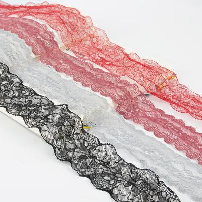 China Elastic Flower Lace Fancy Fabrics Mesh Elastic Lace Trims For Clothing for sale