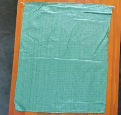 China Green pp woven bag 55*95 price 0.042$/pc 2019-2020 Russia building material recyclable waste for sale