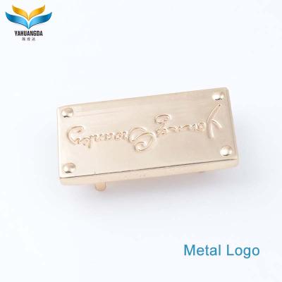 China Viable high quality custom embossed leather metal logo patch, jeans leather patch with metal embossed logo for sale