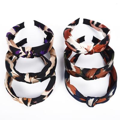 China High quality fabric women leopard printed silk fabric soft knot headdress plastic wide hair accessories for girls for sale