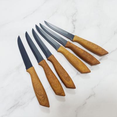 China Sustainable 5 PCS Non Stick Stainless Steel Kitchen Steak Knife Set With Wood Grain Handle for sale