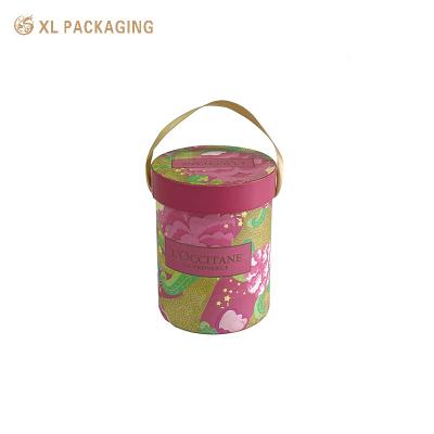 China Pink Cosmetic Paper Tube Face Cream Paper Cylinder Packaging With Ribbon Handle for sale