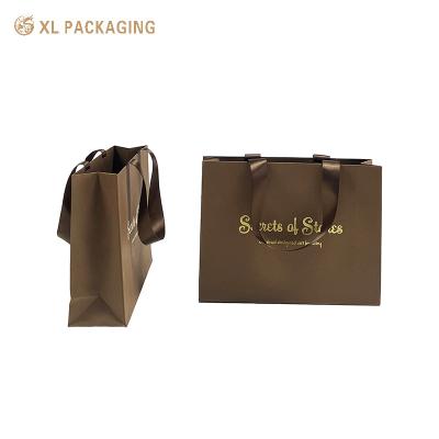 China Brown Big Paper Packaging Bags Personalized Luxury Shopping Tote Gift Paper Bags for sale