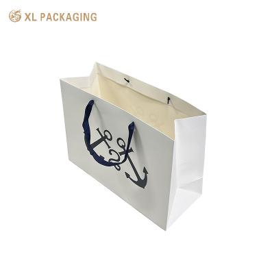 China White Paper Packaging Bags Gold Foil Kraft Paper Clothes Shoes Shopping Bag With Handle for sale