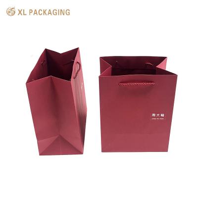 China Folder Paper Bag Wine Red Color Coated Paper Hand Bag For Gift Box Packaging Gift Shipping Bag With Your Own Logo for sale